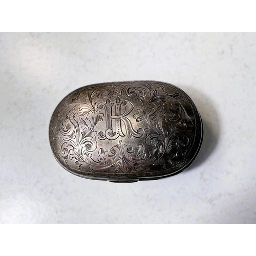 701 - A 19th century unmarked white metal snuff boxed decorated with monogram and birds etc