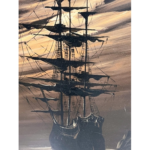 798 - A 20th century three mast sailing ships with sails reefed at night, oil on canvas, signed indistinct... 