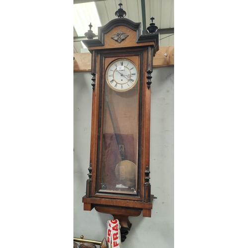 137 - A 19th century walnut Vienna wall clock with ebonised mouldings and finials with double weight drive... 