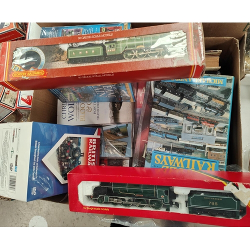 325 - Two boxed Hornby 00-guage locomotives, and a collection of hardback books on trains etc