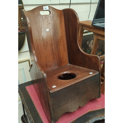 882 - A 19th century mahogany childs rocking commode chair