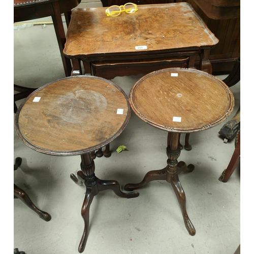 895 - A burr walnut nest of three occasional tables with rectangular dish tops and a pair of pedestal wine... 