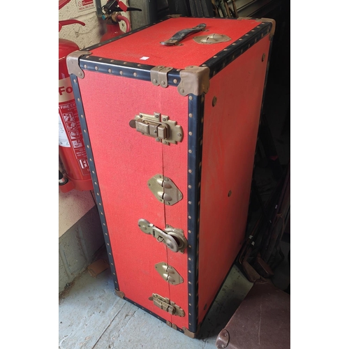 950A - A large red cabin trunk