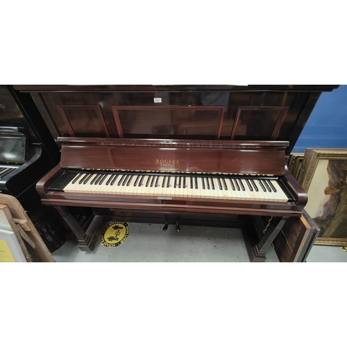 990 - An iron framed over strung upright piano in mahogany case by Rogers, London