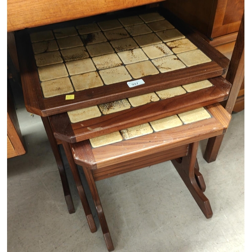 997 - A nest of 3 1970's G-Plan style teak occasional tables with tile tops