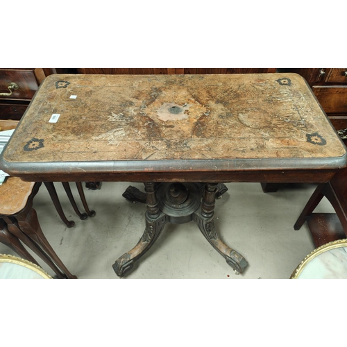 999 - A 19th century inlaid folding table with four pillar support (centre damaged)