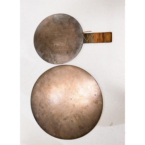 405 - Two Chinese bronze mirrors, one highly polished side, the other embossed, one with handle