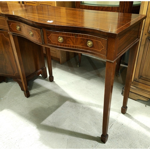 930 - A reproduction mahogany serpentine front side table with two frieze drawers and cross banded burr wa... 