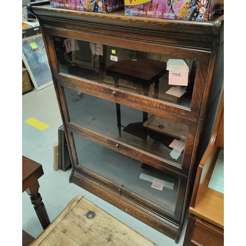 954 - An early 20th Century three height oak sectional bookcase.