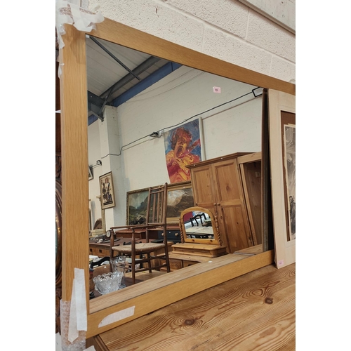 969 - A large rectangular light oak framed wall mirror by 