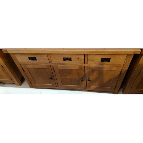 982 - A modern light oak three drawer and three door sideboard 139x84cm