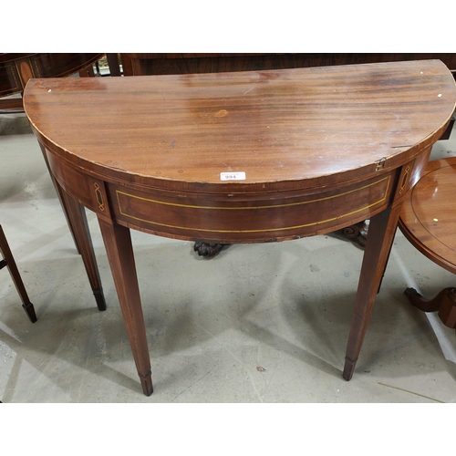 994 - A late 19th/early 20th century mahogany demi-lune fold over inlaid card table