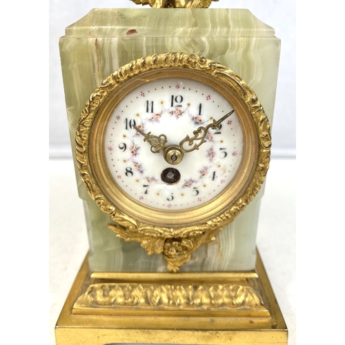 128 - A 19th Century French Ormolu mantel clock with gilt cherub decoration.