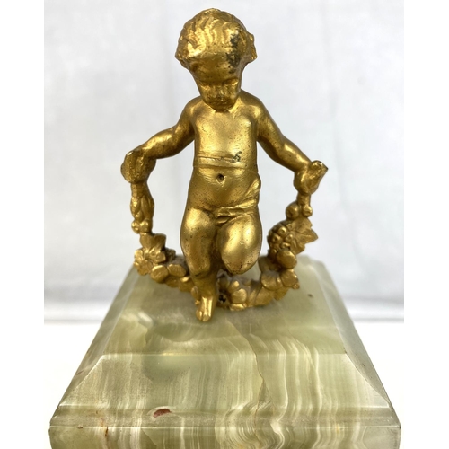 128 - A 19th Century French Ormolu mantel clock with gilt cherub decoration.