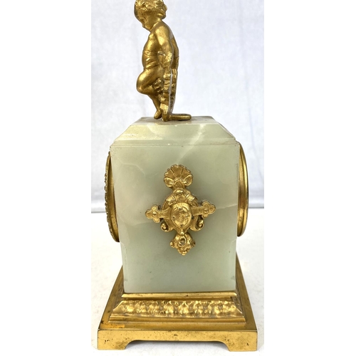 128 - A 19th Century French Ormolu mantel clock with gilt cherub decoration.