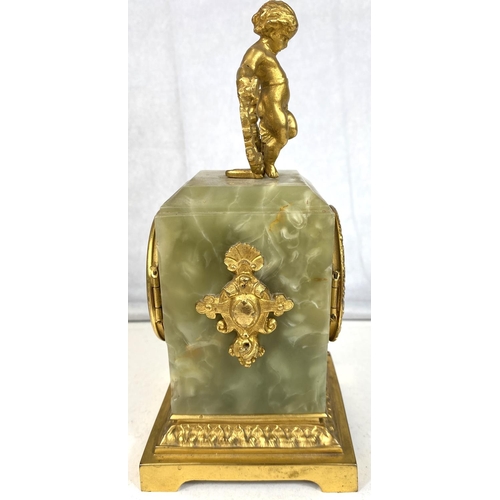 128 - A 19th Century French Ormolu mantel clock with gilt cherub decoration.