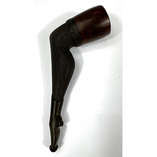 132 - A novelty briar tobacco pipe in the form of a stockinged leg.