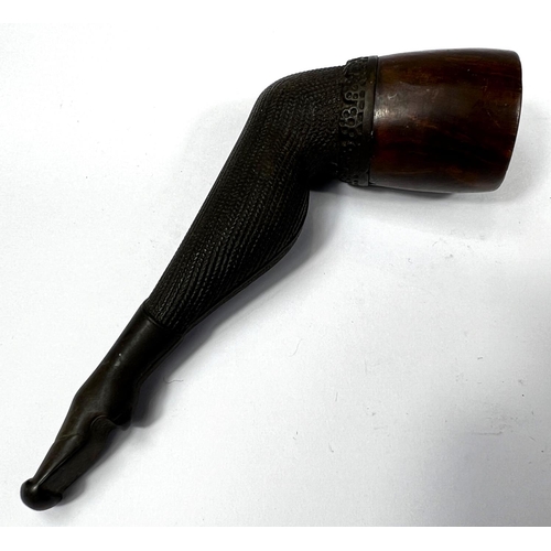 132 - A novelty briar tobacco pipe in the form of a stockinged leg.