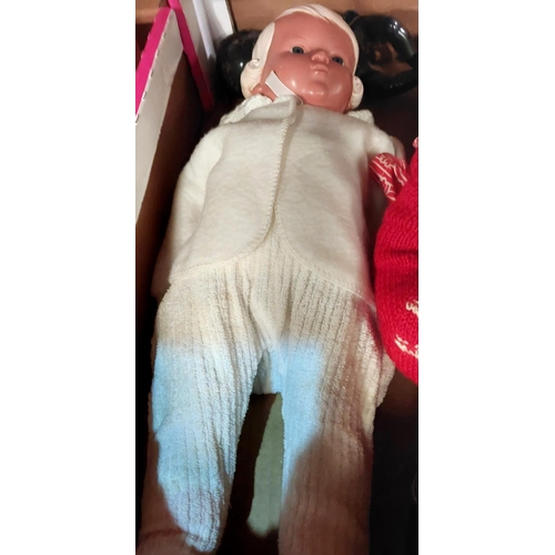 142 - An early/mid 20th century celluloid boy doll, length 55cm, a similar smaller baby doll, another baby... 