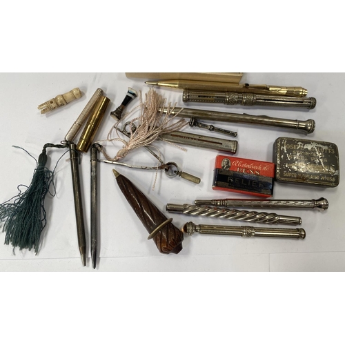 143 - A selection of vintage propelling pencils, a miniature retracting silver button hook and similar hal... 