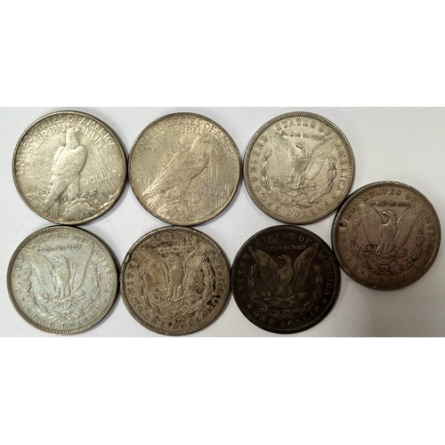 225 - US: 7 silver dollars: 1879, 1884, 1886, 1921 (x2), 1923 (x2)