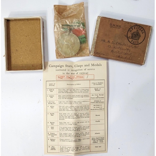 26 - An originally boxed WWII service medal and 3 WWI embroidered post cards