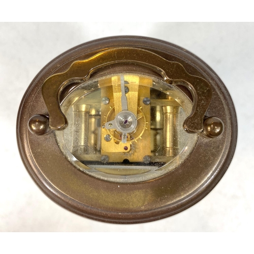 27 - A small oval brass carriage clock by Matthew Norman, ht 8cm, a Zeiss Ikon camera