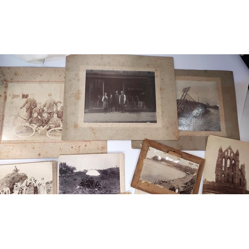 35 - A late 19th Century photograph of a cycle shop, 15x20cm, another photo of cyclists, a selection of o... 