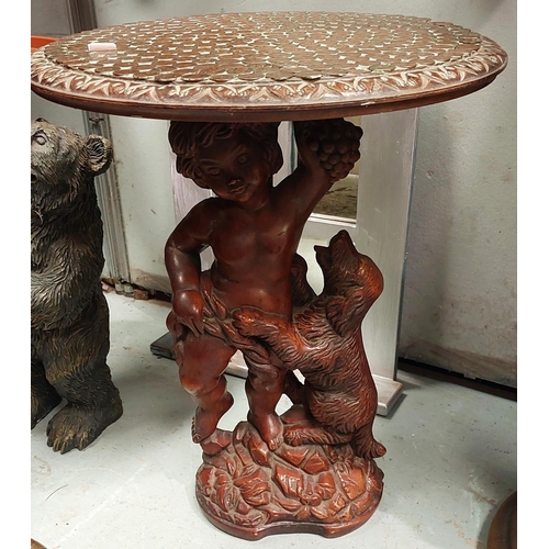 45 - A circular occasional table on resin stand, the top covered with coins; a 