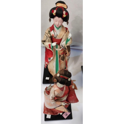 48 - Three costume dolls of Japanese ladies; a 