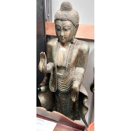 51 - A half life size gilded Buddha figure standing making the sign of peace, ht. 145cm (forearm cracked)