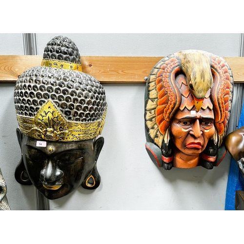 54 - Two large wall hanging face masks, Buddha and Native American chief.