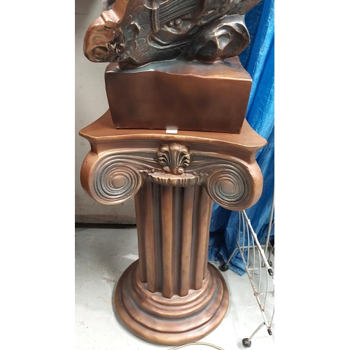 55 - An Art Nouveau style bronzed head and shoulder bust of a young woman on classical column.