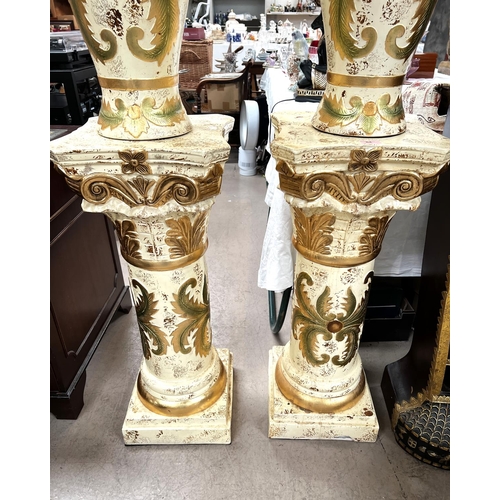 64 - A pair of classical columns in cream and gilt and matching table lamps