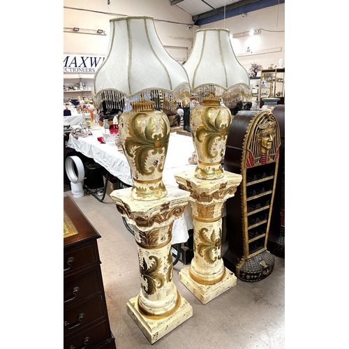 64 - A pair of classical columns in cream and gilt and matching table lamps