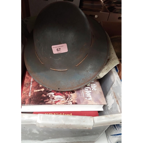 67 - An early to mid 20th Century tin military style helmet with leather interior and a canvas military d... 