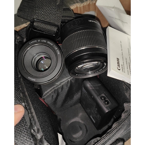 202C - A Canon SLR camera and accessories, 2 pairs of binoculars etc.