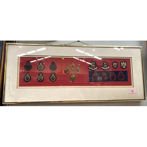 70 - A framed and glazed collection of military badges and a watercolour of modern military ships