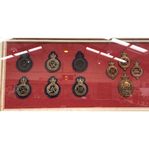 70 - A framed and glazed collection of military badges and a watercolour of modern military ships