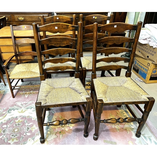 932 - A set of four good quality oak dining chairs with rush seats, turned legs etc and another similar ch... 