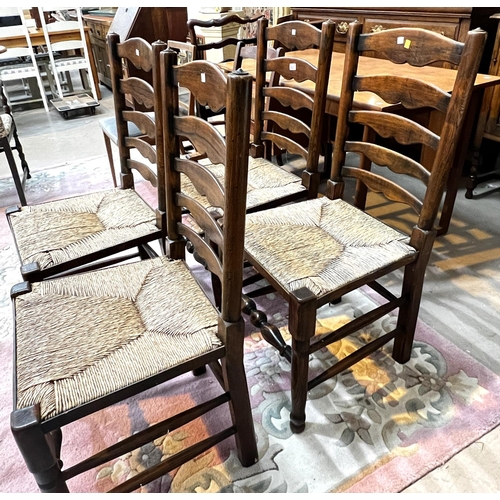 932 - A set of four good quality oak dining chairs with rush seats, turned legs etc and another similar ch... 