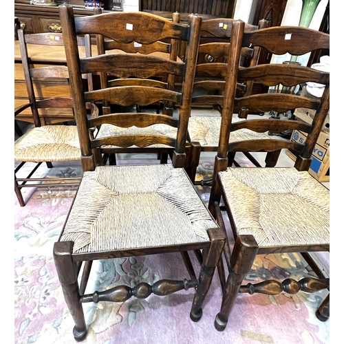 932 - A set of four good quality oak dining chairs with rush seats, turned legs etc and another similar ch... 