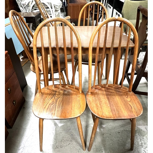 943 - A set of 4 elm and beech hoop and stick back dining chairs and a rectangular wood effect kitchen tab... 