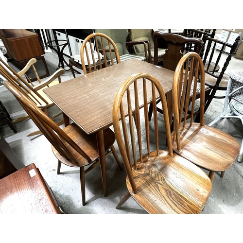 943 - A set of 4 elm and beech hoop and stick back dining chairs and a rectangular wood effect kitchen tab... 