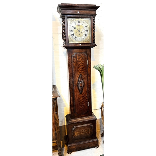 948 - An early 20th century oak longcase clock with barley twist columns to the hood, with square brass di... 