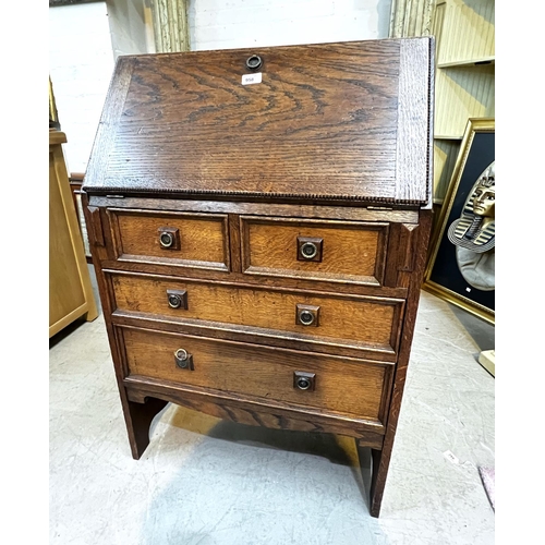 958 - A 1930's oak front bureau with two large drawers and two short drawers.