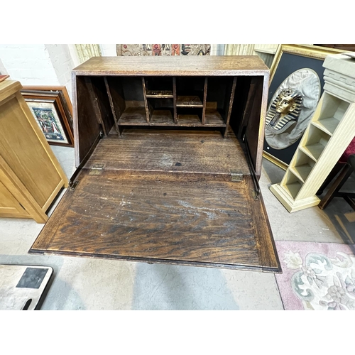 958 - A 1930's oak front bureau with two large drawers and two short drawers.