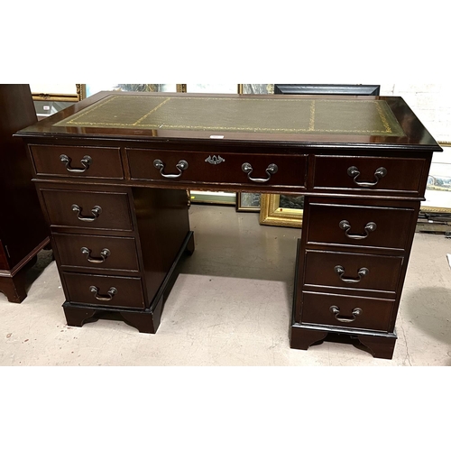 966 - A mahogany twin pedestal kneehole desk of 9 drawers