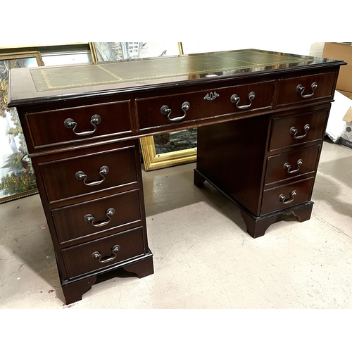 966 - A mahogany twin pedestal kneehole desk of 9 drawers