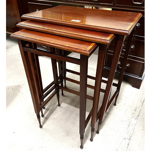 989 - A nest of 3 Edwardian mahogany occasional tables with satinwood crossbanding and square legs